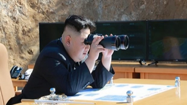 North Korean news shows what was said to be North Korean leader Kim Jong-un watching the launch of a Hwasong-14 ICBM.