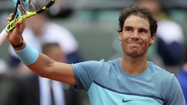 Finding form: Rafael Nadal waves after defeating Australia's Sam Groth.