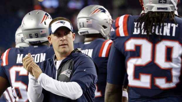 Patriots offensive coordinator Josh McDaniels encourages players against the Houston.