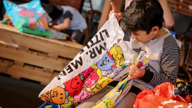 But wait there's more! A child previews a Mr Men showbag ahead of the opening of the 2016 Royal Melbourne Show.