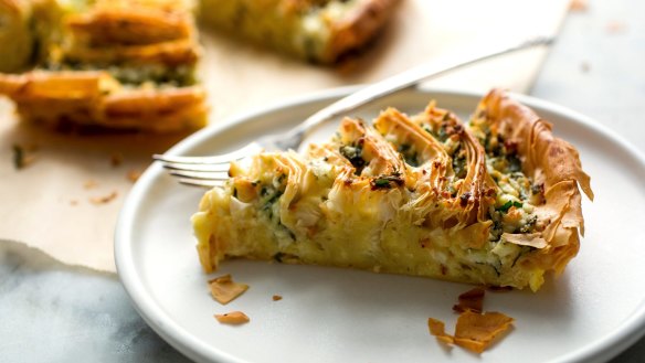 A slice of feta and herb filo tart.