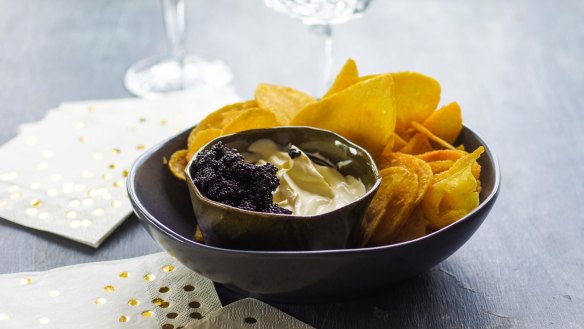 Kettle chips with champagne creme fraiche and caviar.