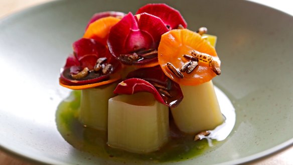 Leeks topped with a colourful carrot halo.