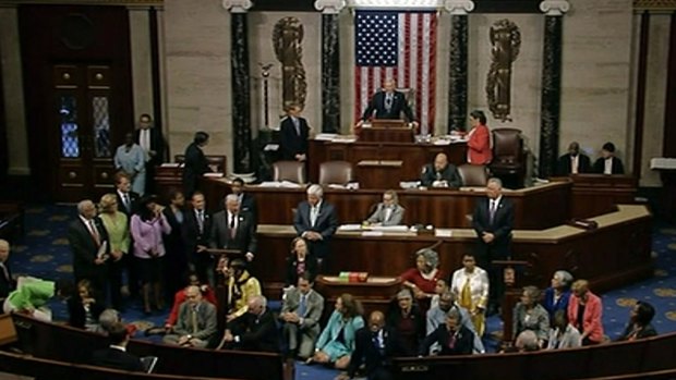 Georgia Representative John Lewis, centre, leads a sit-in in the US Congress of more than 200 Democrats in demanding a vote on measures to expand background checks and block gun purchases by suspected terrorists.