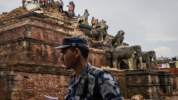 Soldiers clear rubble from a partially collapsed monument in Bhaktapur's Durbar Square.