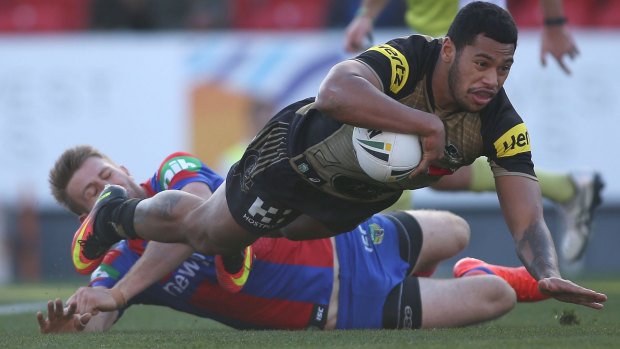Insult to injury: Waqa Blake adds to the Panthers' misery at Hunter Stadium.