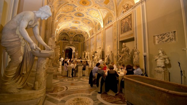 Visitors are seated for dinner in the Vatican.