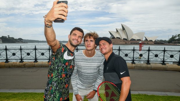 Grigor Dimitrov takes a selfie with Alexander Zverev and Lleyton Hewitt in Sydney.