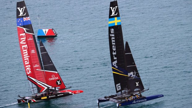 Neck-and-neck: New Zealand, left, competes against Sweden's Artemis Racing.