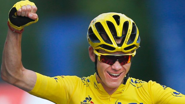 Trying for a third consecutive Grand Tour: Chris Froome celebrates at the Tour de France last year. 