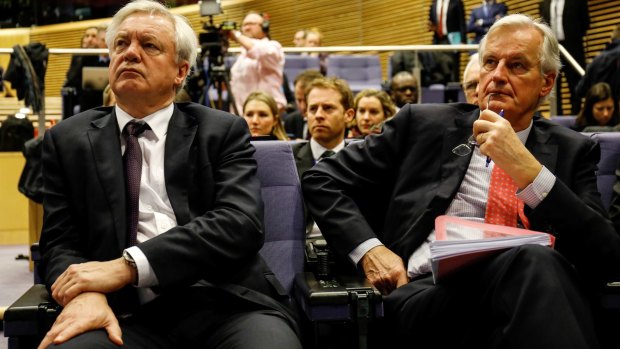 The UK's Brexit Secretary David Davis and chief EU negotiator Michel Barnier in Brussels.