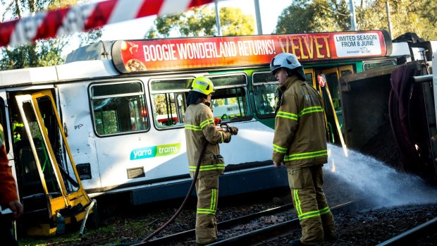 Emergency crews clean up after a collision between a tram and a truck in Parkville in May last year.