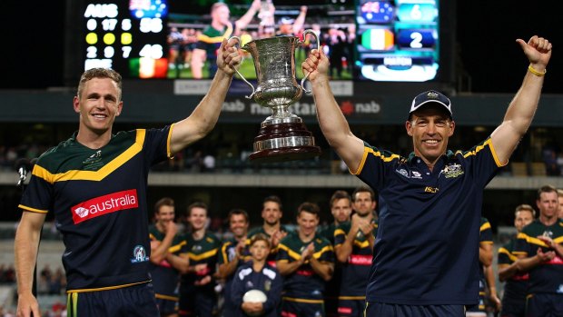 Joel Selwood and Alastair Clarkson hold the Cormac McAnallen cup aloft last year.