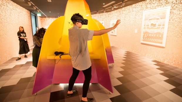 A visitor to the NGV tests out Jess Johnson's new virtual reality exhibition Wurm Haus.