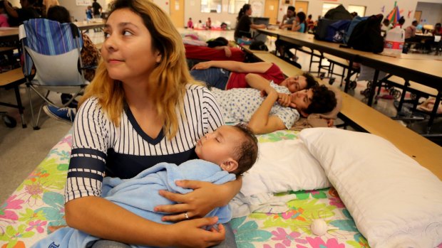 Ivonne Morales and her 9-month-old son, Bruno, at a Red Cross shelter in Fort Pierce, Florida.
