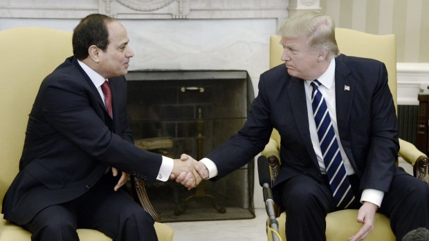 US President Donald Trump, right, shakes hands with Abdel-Fattah El-Sisi, Egypt's president.