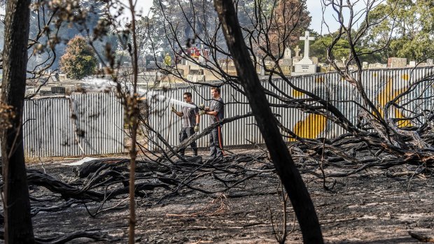 Battling a grass fire near Cheltenham that threatened homes, a school and the local cemetery.