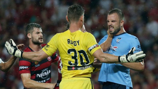 Flashpoint: Matt Jurman of Sydney FC and Wanderers goalkeeper Liam Reddy share a moment of derby passion.