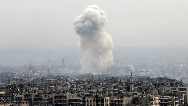 Smoke rises following a Syrian government air strike on rebel positions in eastern Aleppo earlier this month.