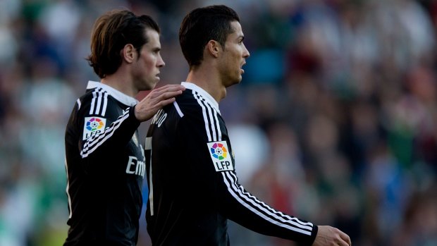 Ronaldo, right, is consoled by teammate Bale.