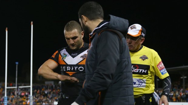Broken: Robbie Farah leaves the field with an injured hand against Penrith on Sunday.