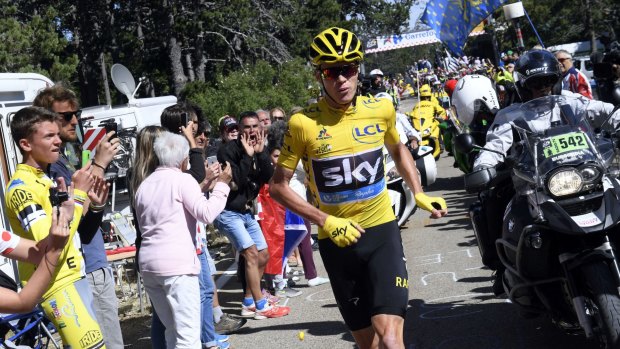 Britain's Chris Froome runs after he crashed at the end of the twelfth stage of the Tour de France.