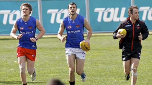 Recovery mode: Luke Davis, Scott Gumbleton and Sam Lonergan during the Bombers' recovery session at Windy Hill in August 2011.

