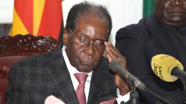 Zimbabwean President Robert Mugabe delivers his speech during a live broadcast at State House in Harare, on November 19.