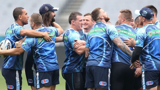 Plotting revenge:  Paul Gallen  (centre) and teammates perform a group hug during a NSW Blues  training session at the Melbourne Cricket Ground on Tuesday.  
