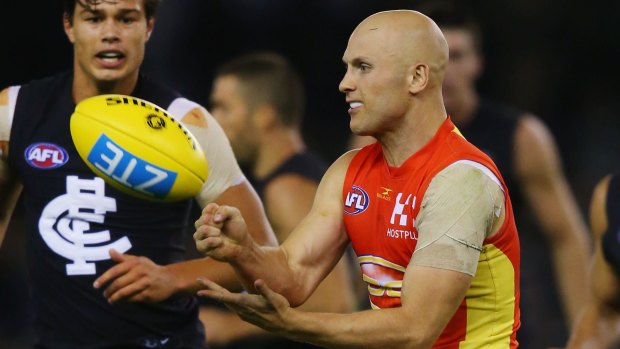 MELBOURNE, AUSTRALIA - APRIL 15: Gary Ablett of the Suns handballs during the round four AFL match between the Carlton Blues and the Gold Coast Suns at Etihad Stadium on April 15, 2017 in Melbourne, Australia. (Photo by Michael Dodge/Getty Images)