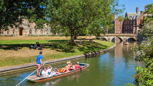 Tourists punting on the river Cam, Cambridge.
