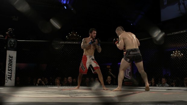 Mixed martial arts fighters battle it out in an Australian Fighting Championship event in Flemington.