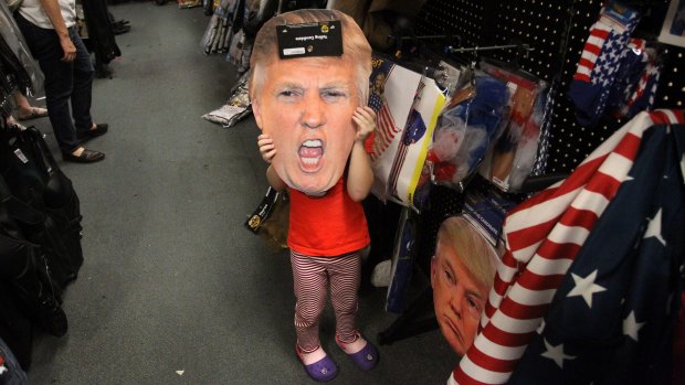 Alina Fisk, 4, poses with a Donald Trump cut-out while Halloween costume shopping with her mother in Florida.