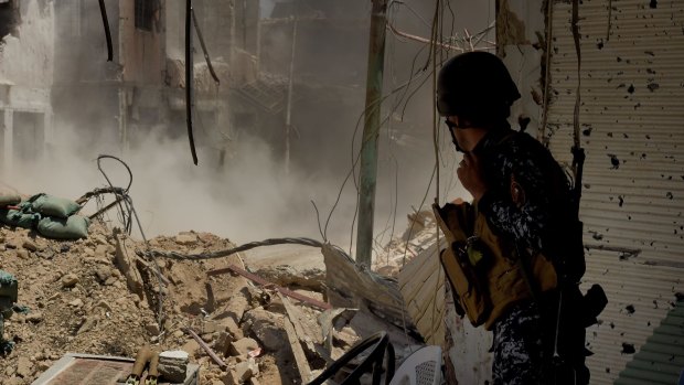 An Iraqi Special Forces soldier watches a planned detonation.