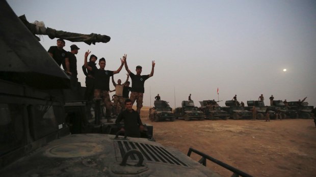 Iraq's elite counter-terrorism forces gather ahead of an operation to re-take Mosul on Friday.