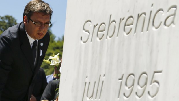 Serbian Prime Minister Aleksandar Vucic
 places flowers during the ceremony marking the 20th anniversary of the Srebrenica massacre in Potocari, near Srebenica.