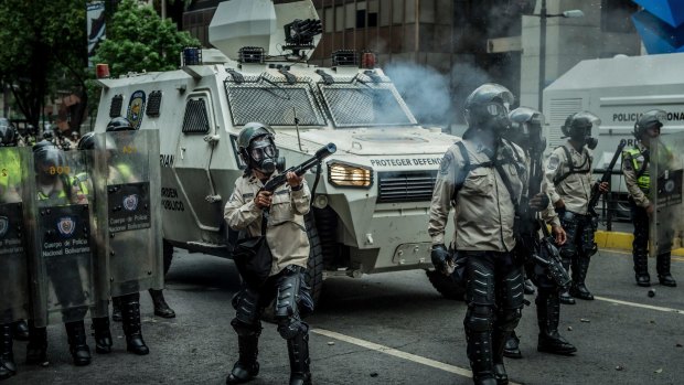 Security forces confront anti-government protesters in the Venezuelan capital.