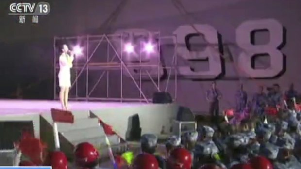 A singer performs for Chinese navy officers and construction workers on Fiery Cross Reef in the South China Sea, one of those complicated parts of the world. 