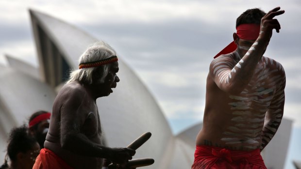 Dancers from the Koomurri perform on Sydney Harbour to promote Australia Day festivities.