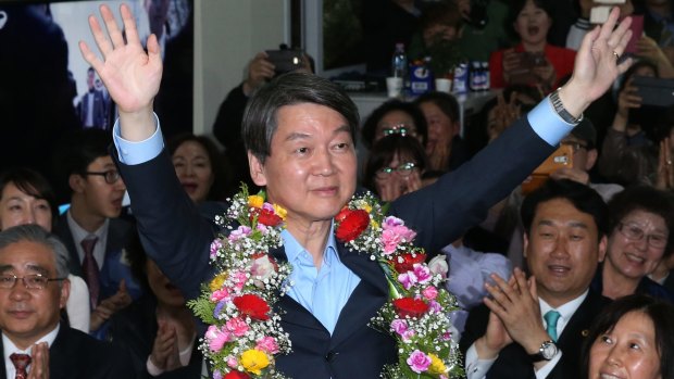 Ahn Cheol-soo, co-chairman of the opposition People's Party, celebrates his victory in the South Korean parliamentary elections on Wednesday.