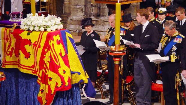 The Queen, Prince Philip, Prince William and Prince Charles attend the Queen Mother's  funeral  at Westminster Abbey in April 2002. The crown seen on her coffin contains the Koh-i-Noor diamond.