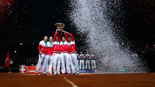 The Swiss team of Roger Federer, Stanislas Wawrinka, Marco Chiudinelli, Michael Lammer and Severin Luthi celebrate their country's first Davis Cup win.