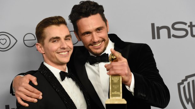 James Franco (r) with brother Dave following his Golden Globes win for best actor.