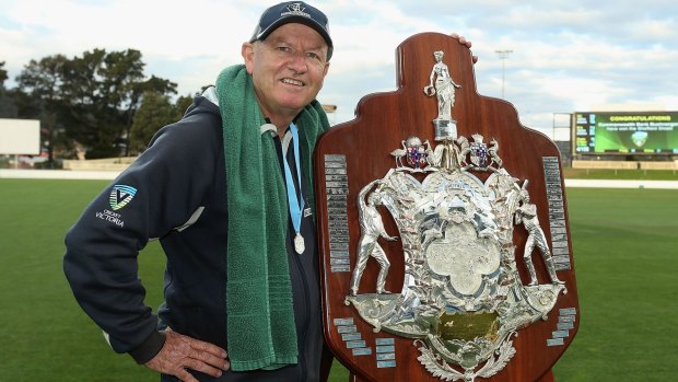 Shipperd poses with the Sheffield Shield, the fourth of his tenure.