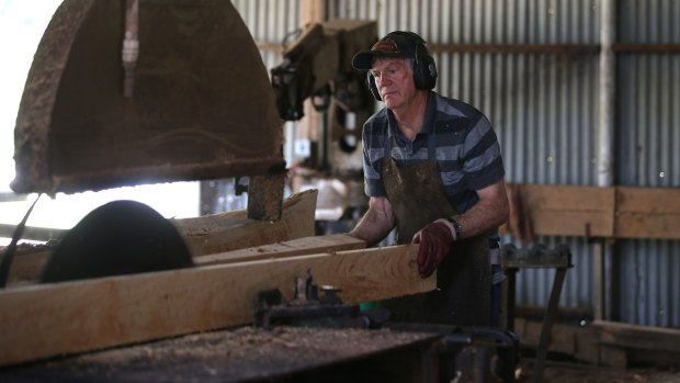Ray Smith working in the sawmill.