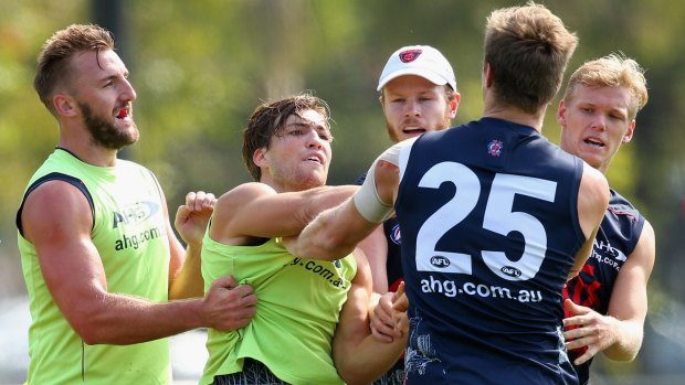 It's getting heated: Jack Viney and Tom McDonald clash at training.