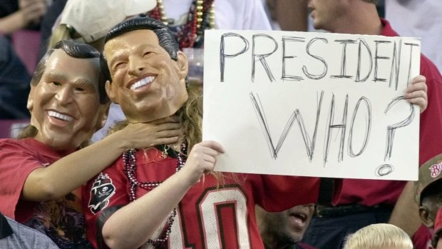 Memories of an earlier contested election: in 2000, fans, one dressed as Republican presidential candidate Texas Gov. George W. Bush, left, playfully chokes a fan dressed as Democratic presidential candidate Vice President Al Gore, during a football game.