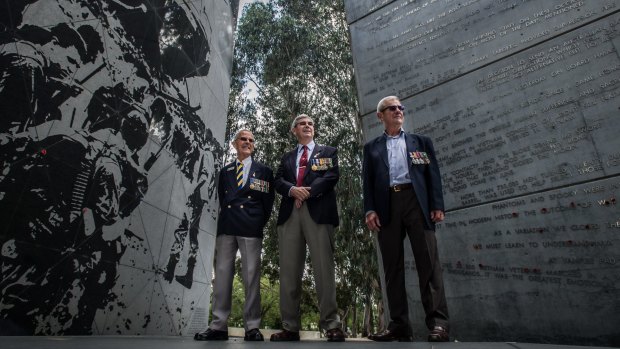Three of Canberra's Vietnam veterans meet at the Vietnam War memorial. From left: Jack Aaron, Peter Dinham and Greg Kennett.