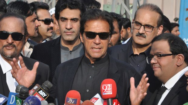 Former cricketer, now Pakistan's Opposition Leader Imran Khan, centre, said Trump was "ignorant and ungrateful" after the US leader accused Pakistan of harbouring terrorists.