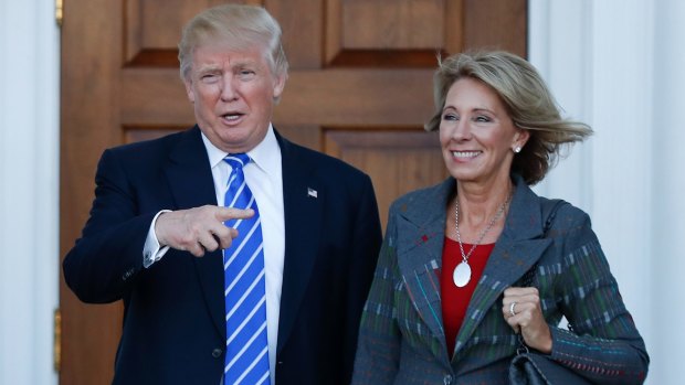 Donald Trump and Betsy DeVos. Will the President-elect's latest cabinet choices blunt criticism of white man bias?